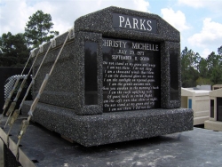 Single deluxe mausoleum in deep gray with granite inlays in the columns in Fayetteville, TN