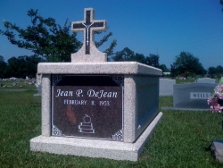 Single basic mausoleum with a cross in Pascagoula, MS