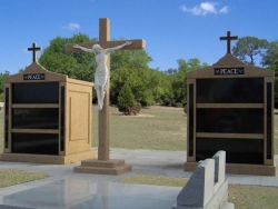 Two six-space tall mausoleums with crosses, granite inlays in the columns, a large cross with the Corpus in Jennings, LA