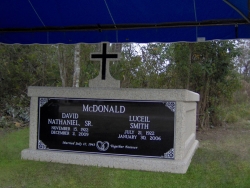 Side-by-side basic mausoleum with a cross