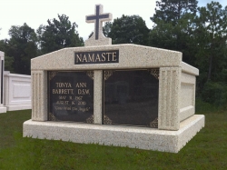 Side-by-side deluxe mausoleum with a cross and fluted columns in Gulfport, MS