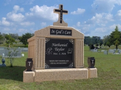 Single deluxe mausoleum with cross, vases and pedestals in Pascagoula, MS