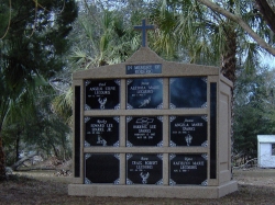 Nine-space mausoleum with large cross and granite inlays in the columns in Crystal River, FL