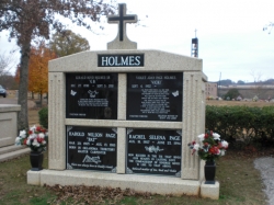 Four-space deluxe mausoleum with cross, fluted columns, vases on pedestals in Trussville, AL