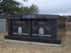 Side-by-side black granite mausoleum on a foundation in Hurley, MS