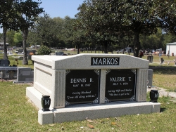 Side-by-side deluxe mausoleum with fluted columns and vases on pedestals in Macclenny, FL