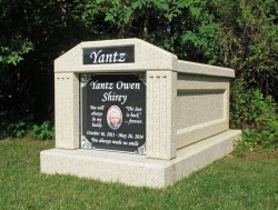 Single deluxe mausoleum with fluted columns and a large porcelain photo plaque in Huntersville, NC