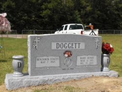 Double upright headstone with two vases in Escatawpa, MS