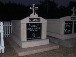 Single deluxe mausoleum with cross and fluted columns on a foundation/slab in Bay St. Louis, MS