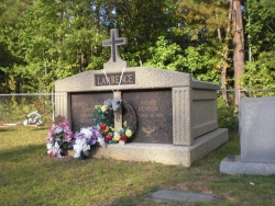 Side-by-side deluxe mausoleum with fluted columns and a cross in Linden, AL