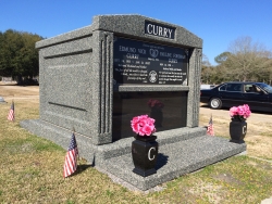 Four-space deluxe mausoleum deep gray with fluted columns, vases on pedestals, extra large step-up trim in Pascagoula, MS