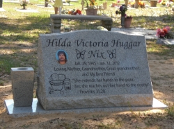 Single granite slant headstone with a vase and all on a base in Biloxi, MS