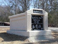 Single deluxe mausoleum with fluted columns in Taylorsville, MS