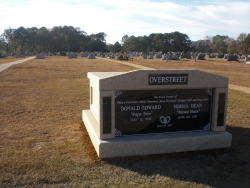 Deluxe side-by-side white mausoleum with engraved granite inlays in the columns in Kosciusko, MS