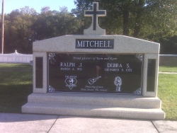 Side-by-side deluxe white mausoleum with cross, granite inlays in the columns and one step in Millsboro, DE