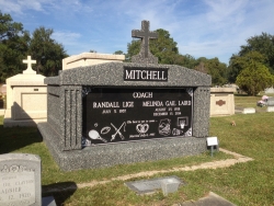 Side-by-Side deluxe FORTRESS mausoleum with a cross and with deep gray stone in Pascagoula, Mississippi